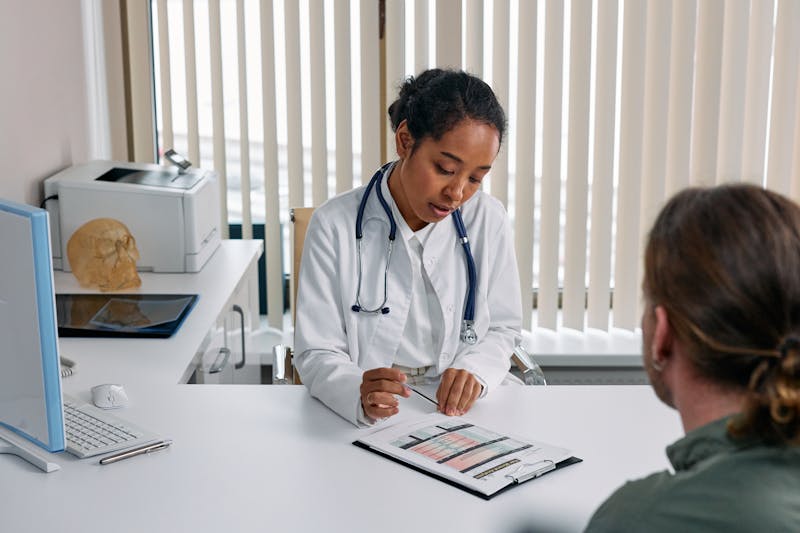 Doctor meeting with patient about prescription.